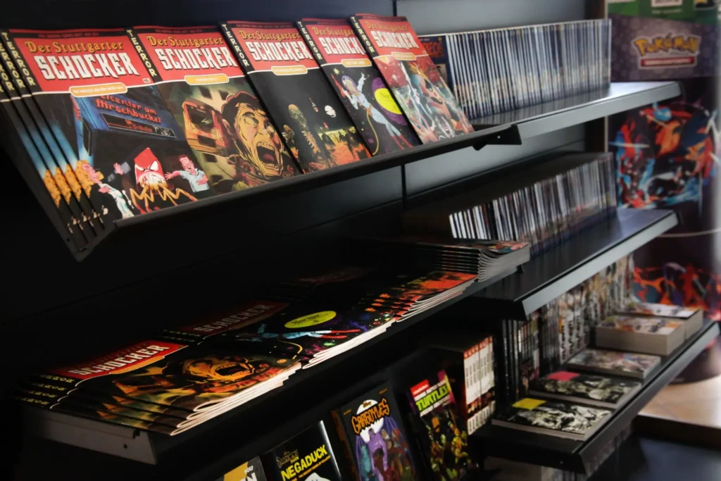 Große Auswahl an Comics und Graphic Novels von Batman, Assassin’s Creed und Spawn bei Outer World 0711 in Stuttgart